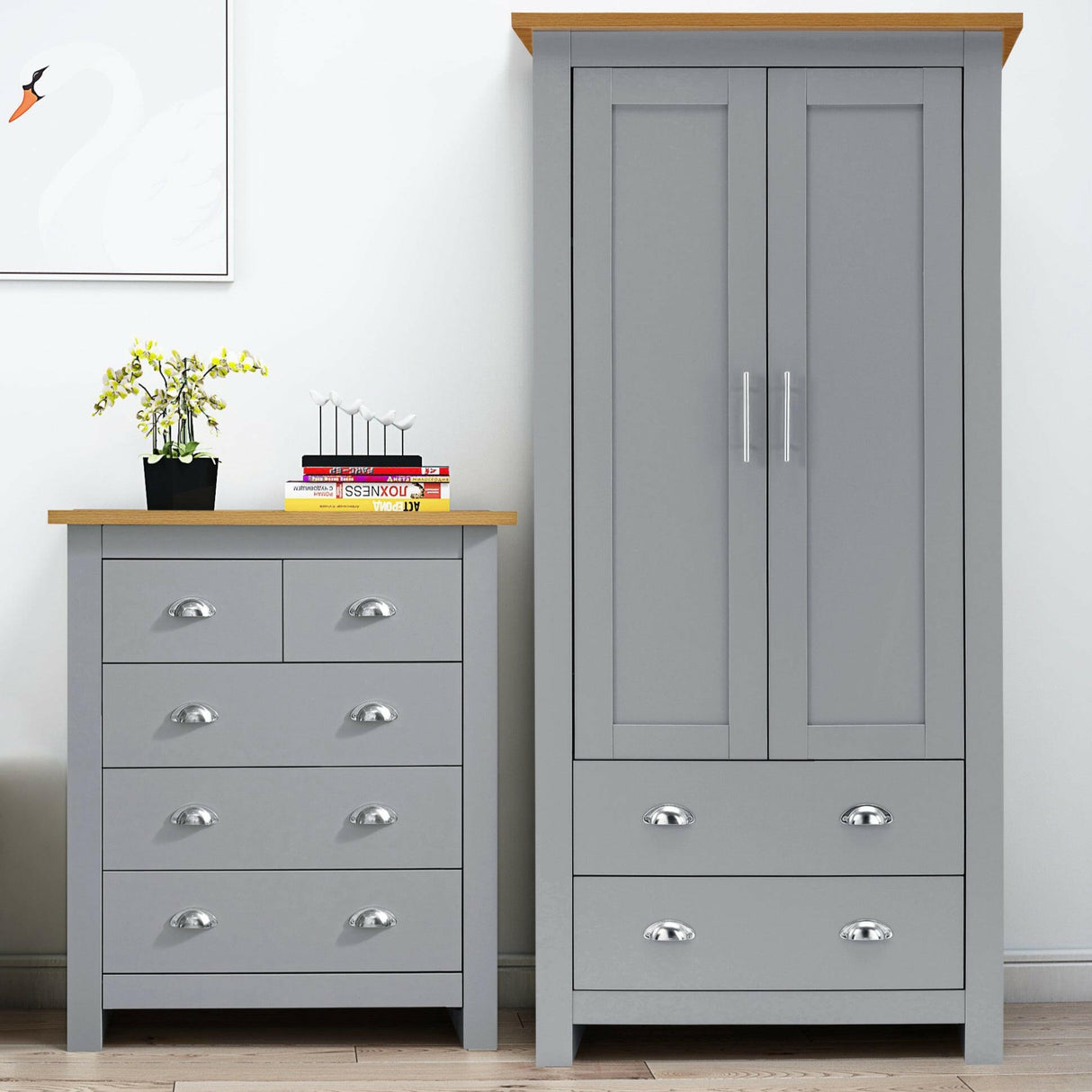 Grey bedroom furniture set with a dresser and wardrobe featuring chrome handles.