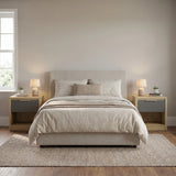 [Oak+Grey] Oak bedside table with grey drawer next to bed flanked by linen pillow and styled accessories