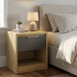 [Oak+Grey] Oak bedside table with grey drawer and open shelf styled beside upholstered bed with lamp and plant