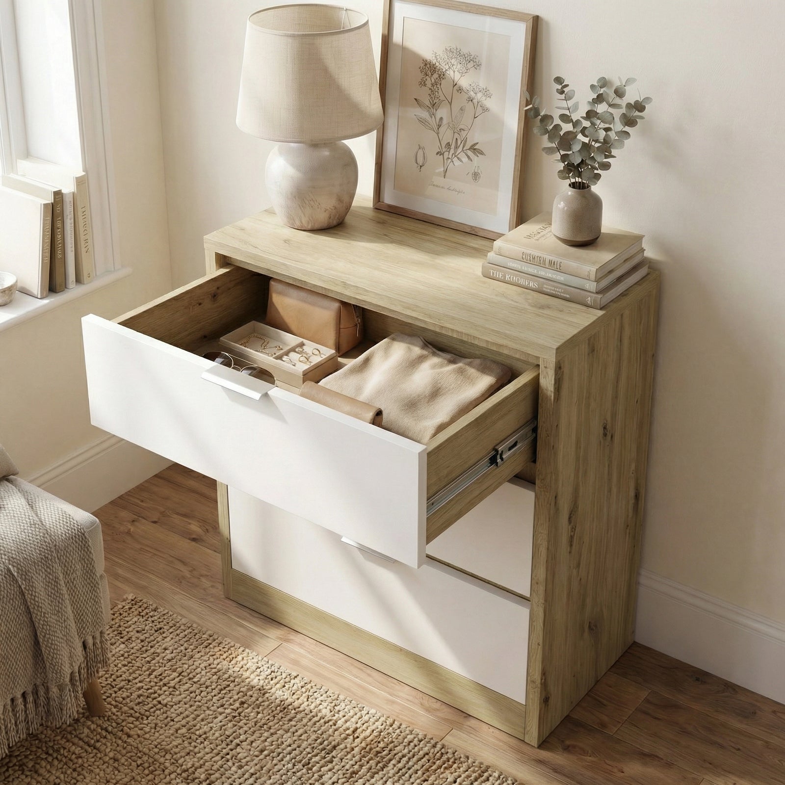[Oak+White] Top drawer of Skova chest of drawers open from above showing folded textile and small box inside