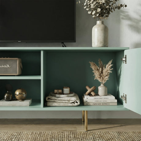 Green TV cabinet with open central shelving and fluted doors, showcasing organized storage for media and decor.