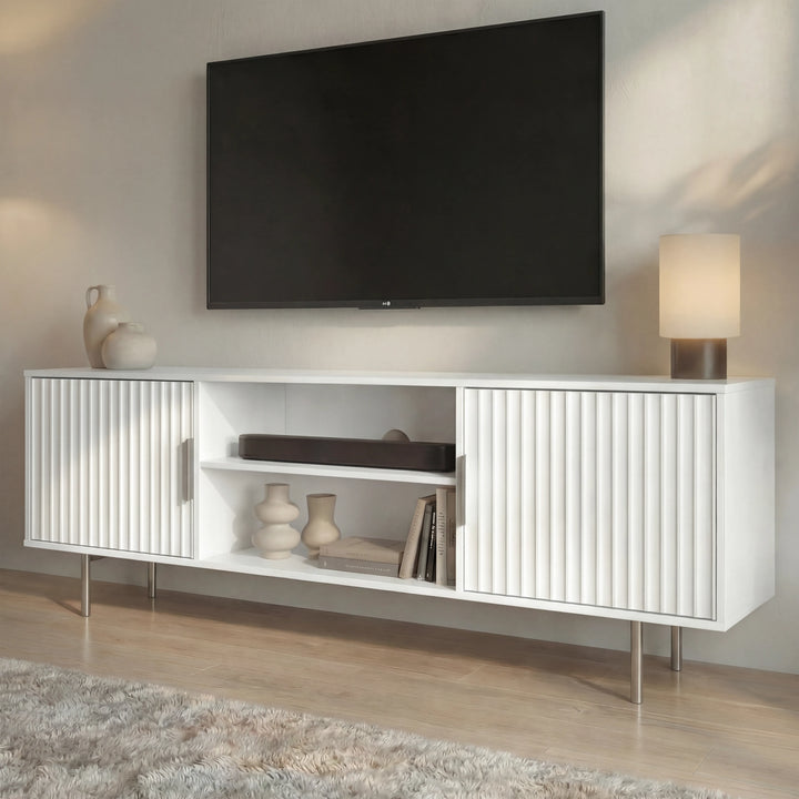 [White]  Flutrina TV unit angled view with ribbed fronts, books and vases on the centre shelf and slim metal legs