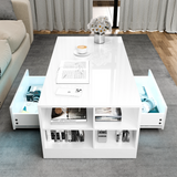 Modern white coffee table with storage compartments in a living room setting.