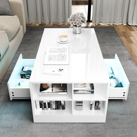 Modern white coffee table with storage compartments in a living room setting.
