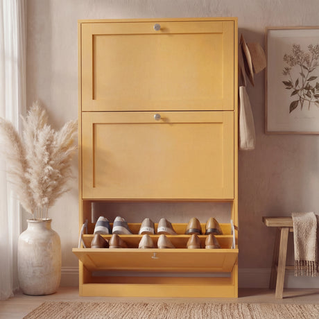 Yellow shoe storage unit shown closed in front elevation with compact vertical shaker design