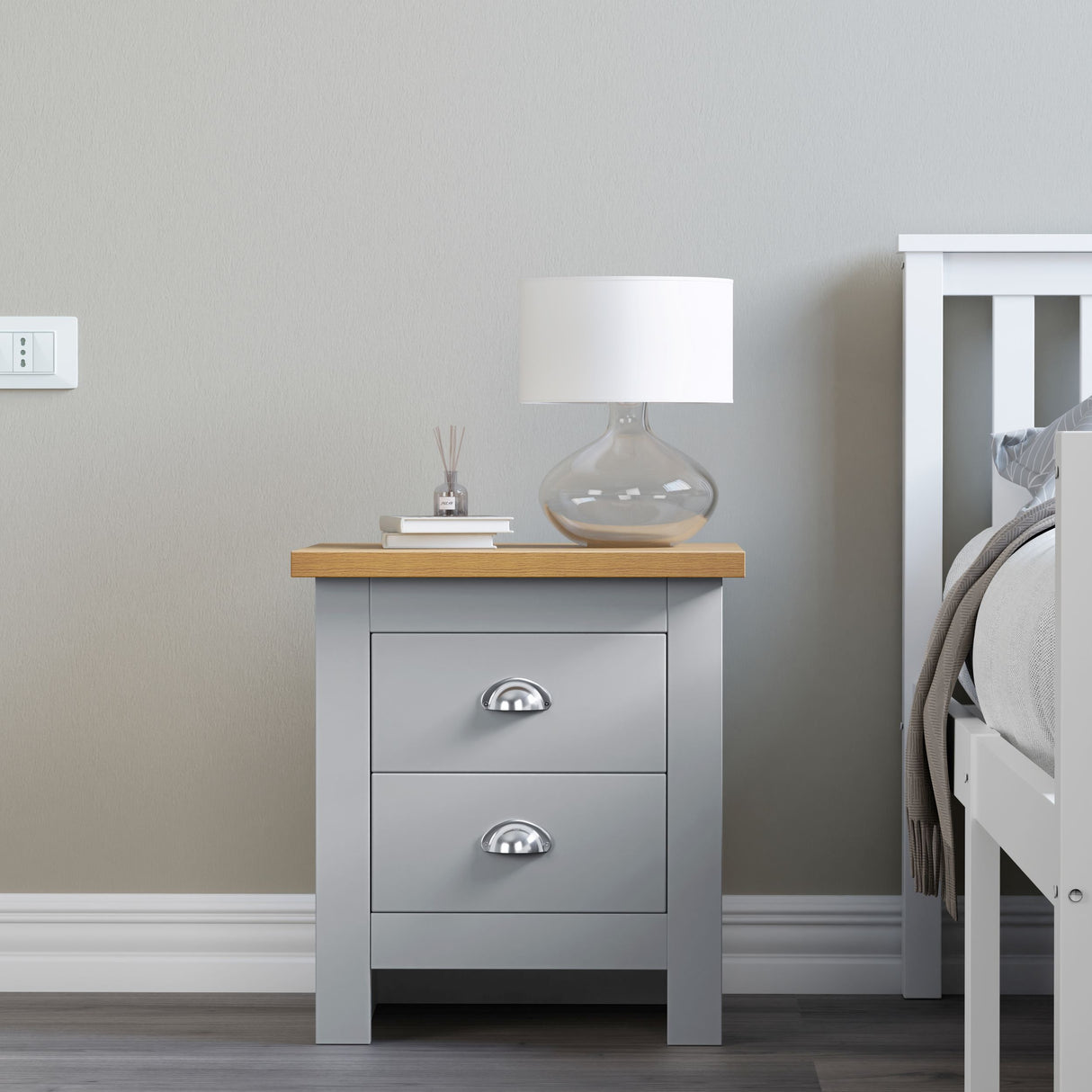 Modern grey bedside table with books and lamp on top stylish and functional for bedrooms