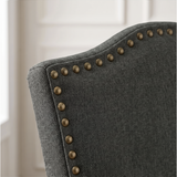[Dark Grey | Set of 2] Close-up detail of bronze nailhead trim on Dark Grey fabric dining chair back.
