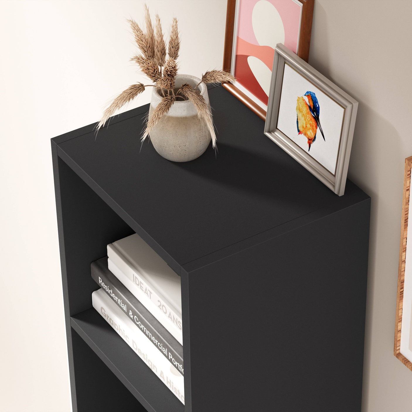 Top surface of black Blisswood bookcase with decorative items, ideal for compact modern interiors.