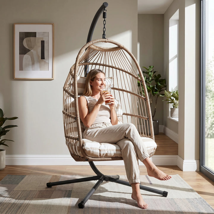 [Natural] foldable garden egg chair with cushion indoors with woman relaxing by sipping coffee