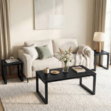 [Black] Nestline nesting coffee table set styled in a soft room with beige chairs, curtains, framed art, and rug