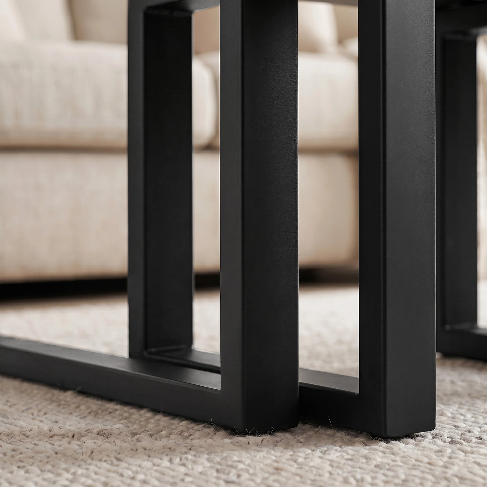 [Black] Nestline nesting table view showing nested frame detail with black metal legs aligned beneath the large table