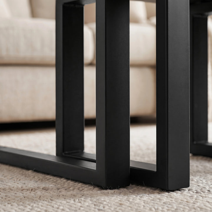 [Black] Nestline nesting table view showing nested frame detail with black metal legs aligned beneath the large table