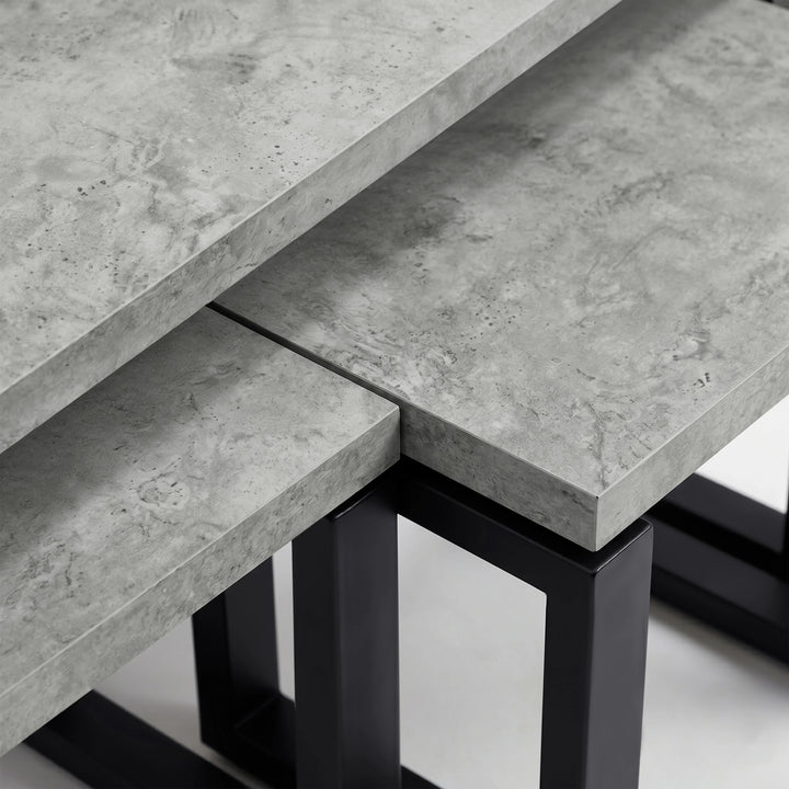 [Concrete] Nestline nesting coffee table showing grey stone-effect top meeting the square black metal support frame