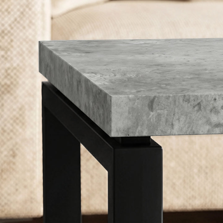 [Concrete] Nestline nesting coffee table's  thick grey stone-effect edge and black metal leg corner connection