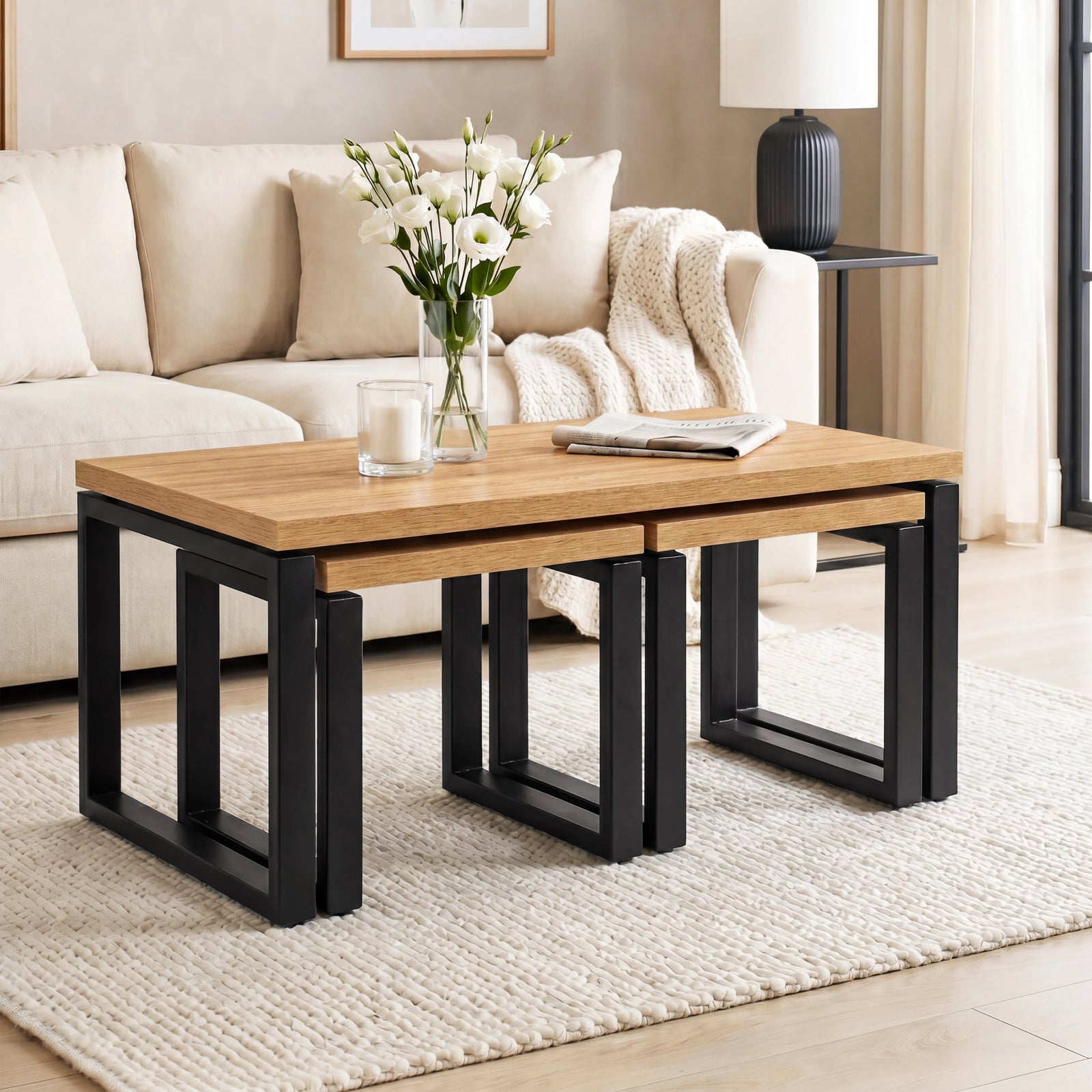 [Oak Effect] Nestline nesting table in a bright lounge with cream sofa, vase flowers, and small nested side tables