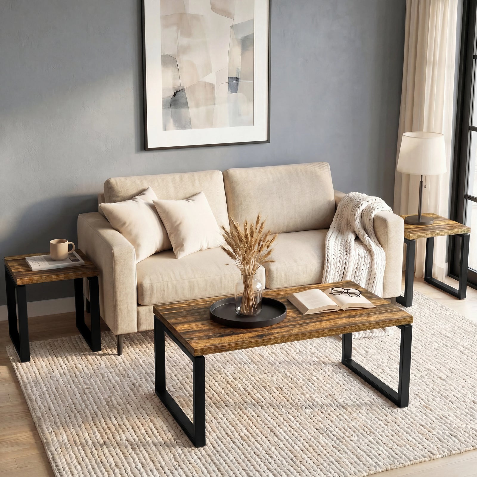 [Rustic] Nestline nesting coffee table set styled in a calm room with beige sofa, wall art, and a pale textured rug