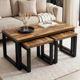 [Rustic] Nestline coffee table set beside a cream sofa, with books and dark bowl on top with nesting side tables below