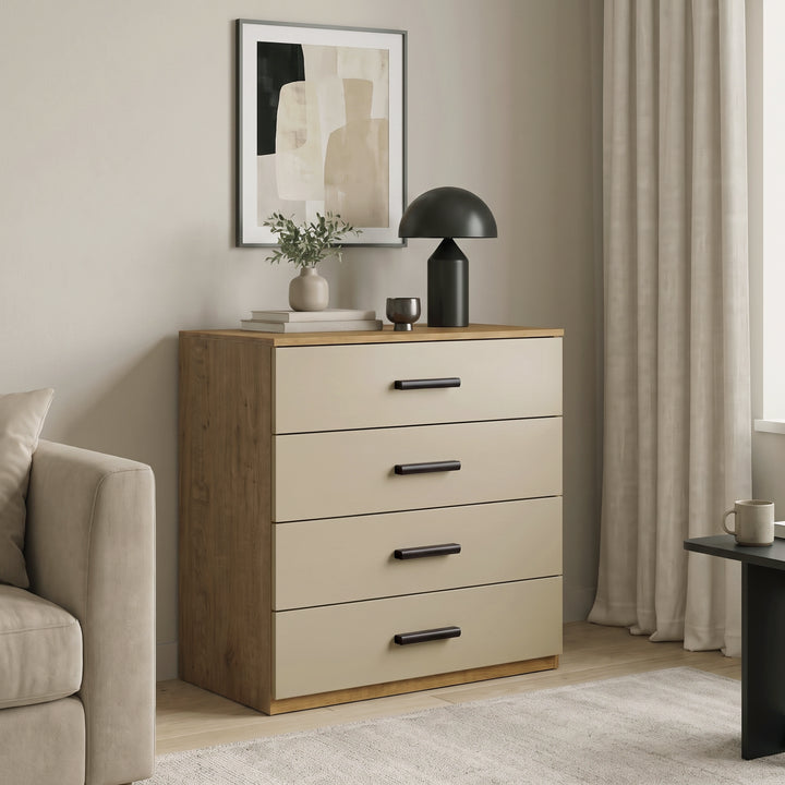 [Oak+Cashmere] Oak frame 4-drawer chest with beige drawers styled next to a cream armchair and table lamp in a living room