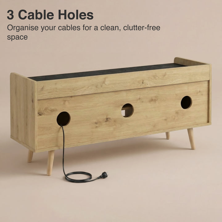 [Oak+Black] Rear of TV unit showing three round cable cut outs with black power cable threaded through middle hole