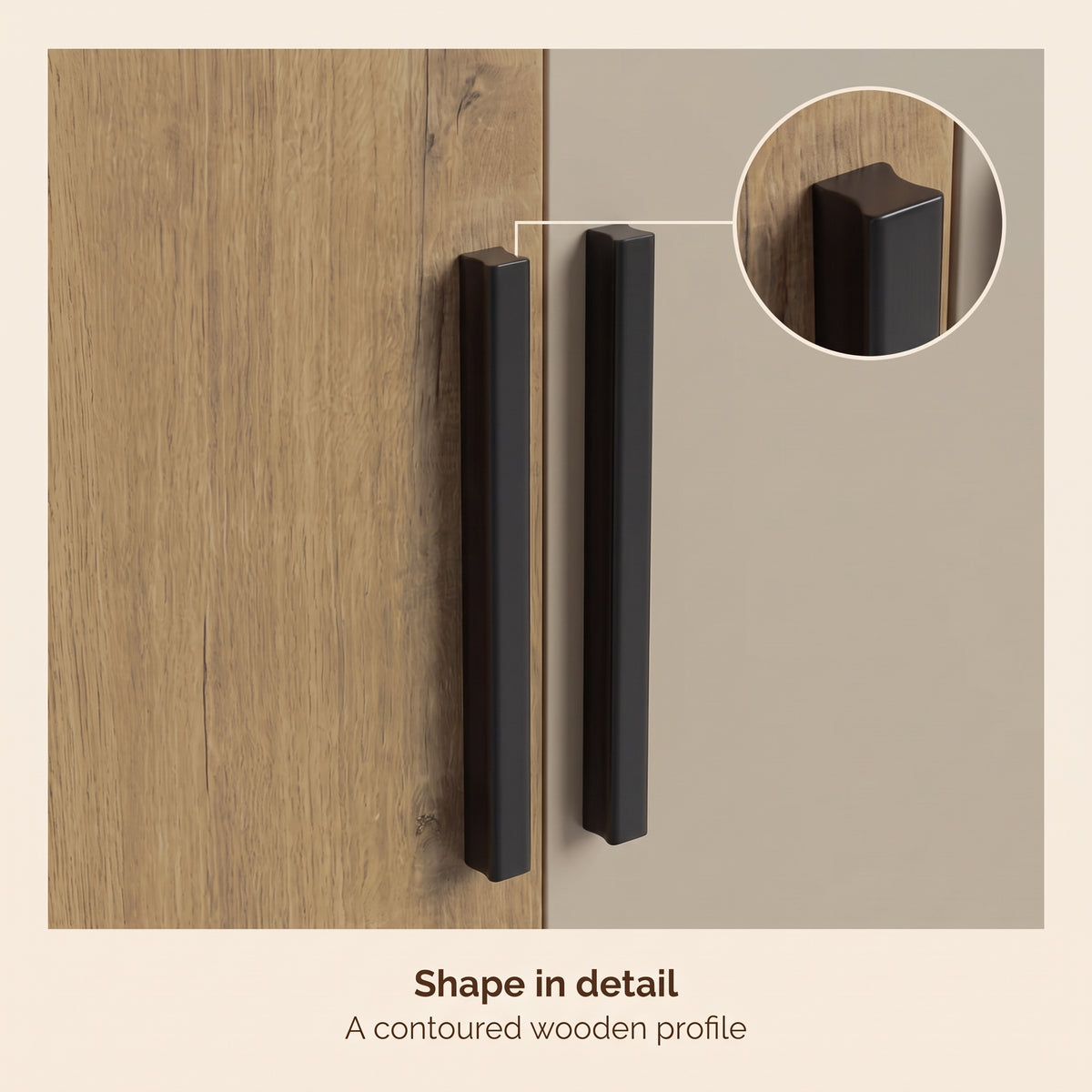 [Oak+Cashmere] Close-up of black vertical handles on mixed panel doors with inset handle shape detail
