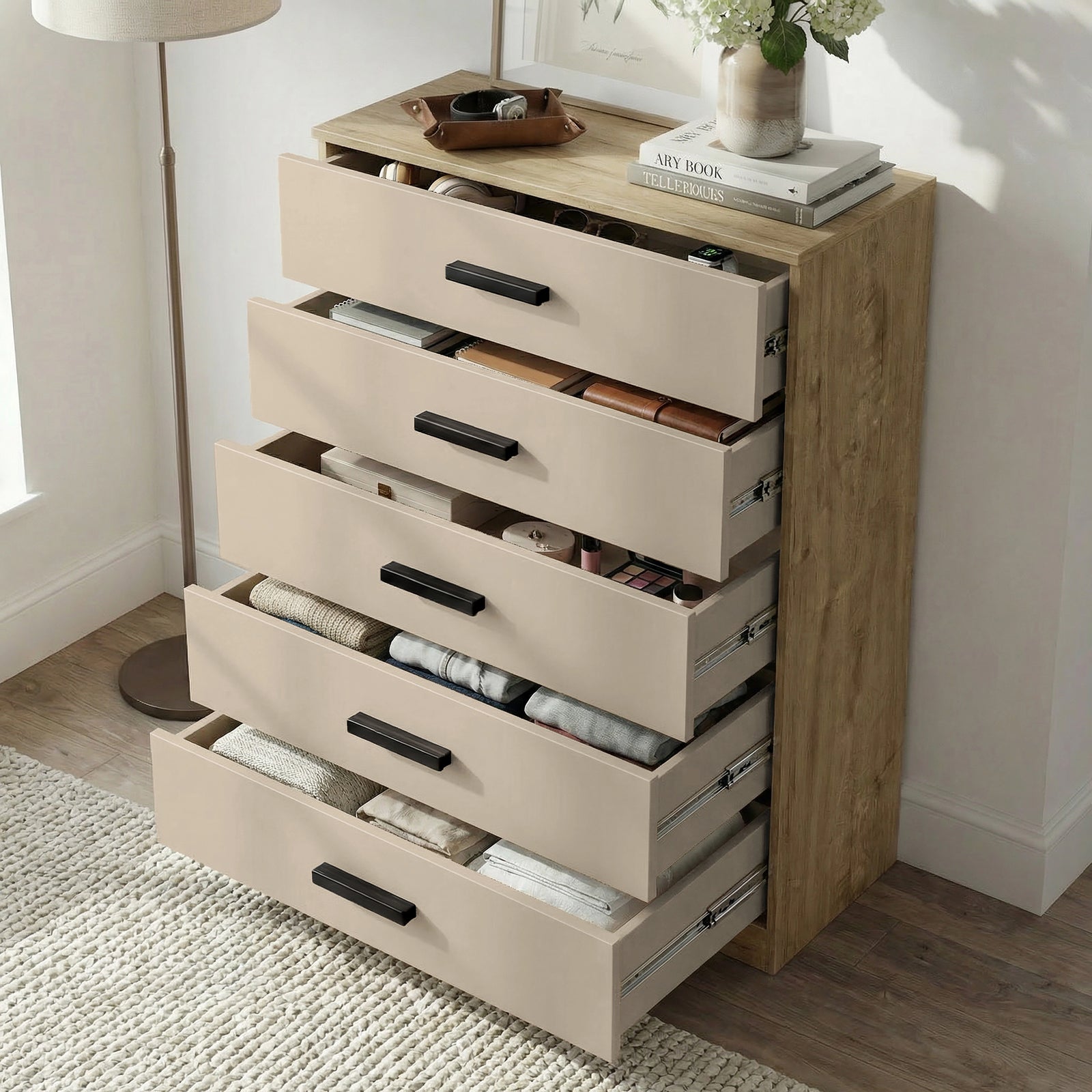 [Oak+Cashmere] five drawer chest shown at angle with drawers open, revealing storage depth