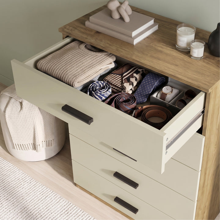 [Oak+Cashmere] Top cashmere drawer of the Oak Cashmere Tall 5 Drawer Chest opened showing stored items.