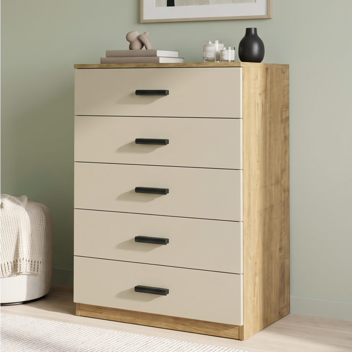[Oak+Cashmere] Angled view of the Oak Cashmere Tall 5 Drawer Chest with cashmere drawers and black handles.