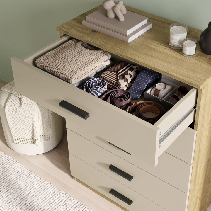 [Oak+Cashmere] Top cashmere drawer of the Oak Cashmere Tall 5 Drawer Chest opened showing stored items.