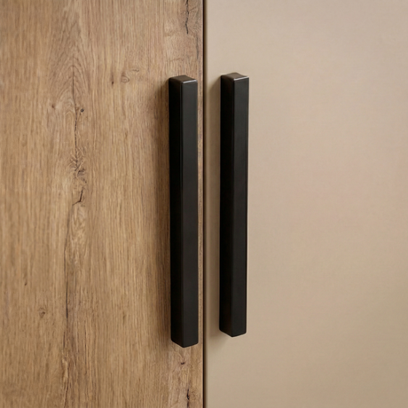 [Oak+Cashmere] Close view of black handles fitted on oak and cashmere two door plain wardrobe displaying its unique design