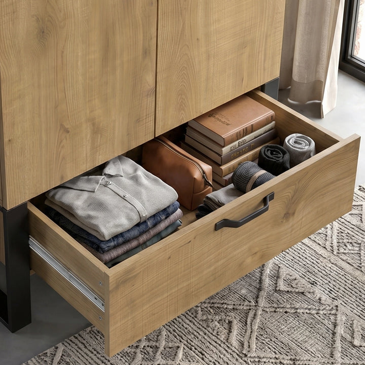 [Oak Effect] Rustvale drawer detail showing folded clothes, wash bag, books, rolled socks, metal runners, and rug.