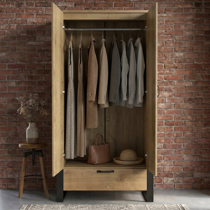 [Oak Effect] Rustvale wardrobe with doors open, showing hanging rail, jackets, dress, handbag, hat, and brick wall.