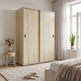 [Oak Effect] Torvek sliding wardrobe in bright bedroom showing hanging rail, upper shelf and folded clothes