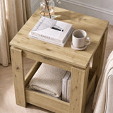 [Oak] High-angle view of the square side table top and open lower storage with books and a folded throw
