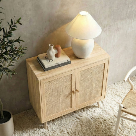 [Oak Effect] Wovena sideboard seen from above in a styled room with a ceramic mushroom lamp, sculptural vases on stacked books, and an olive tree to the left