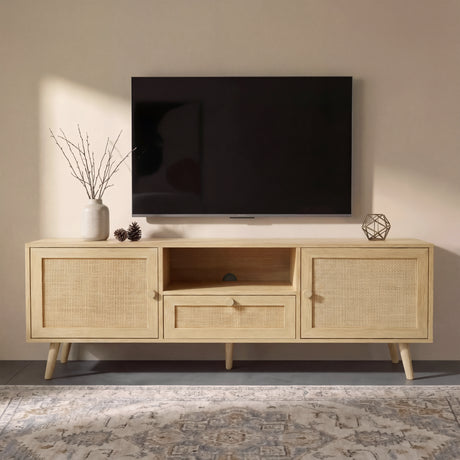 [Oak Effect] Wovena TV unit in a warm living room beneath a wall-mounted TV, styled with bare branch stems, pine cones, and a geometric metal ornament