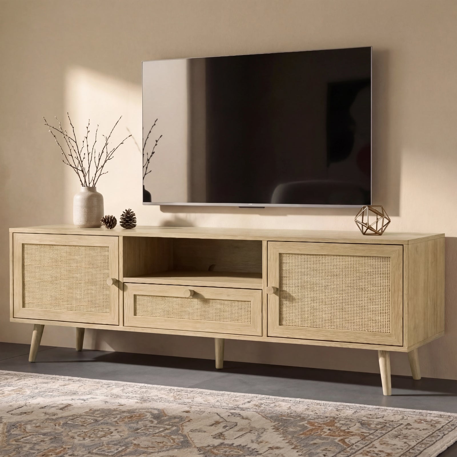 [Oak Effect] Wovena rattan TV unit on patterned rug below wall-mounted TV, ceramic vase and gold ornament on top