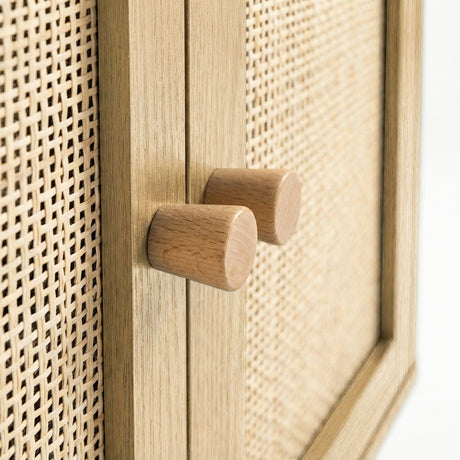 [Oak Effect] Wovena close-up of two solid cylindrical oak knob handles on the oak effect centre door divider, with open-weave rattan panels filling the frame on both sides