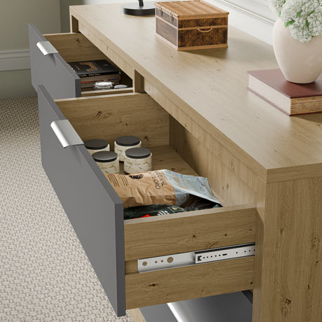 Wooden grey chest of drawers with two drawers partially open with smooth runner, showing small jars and items