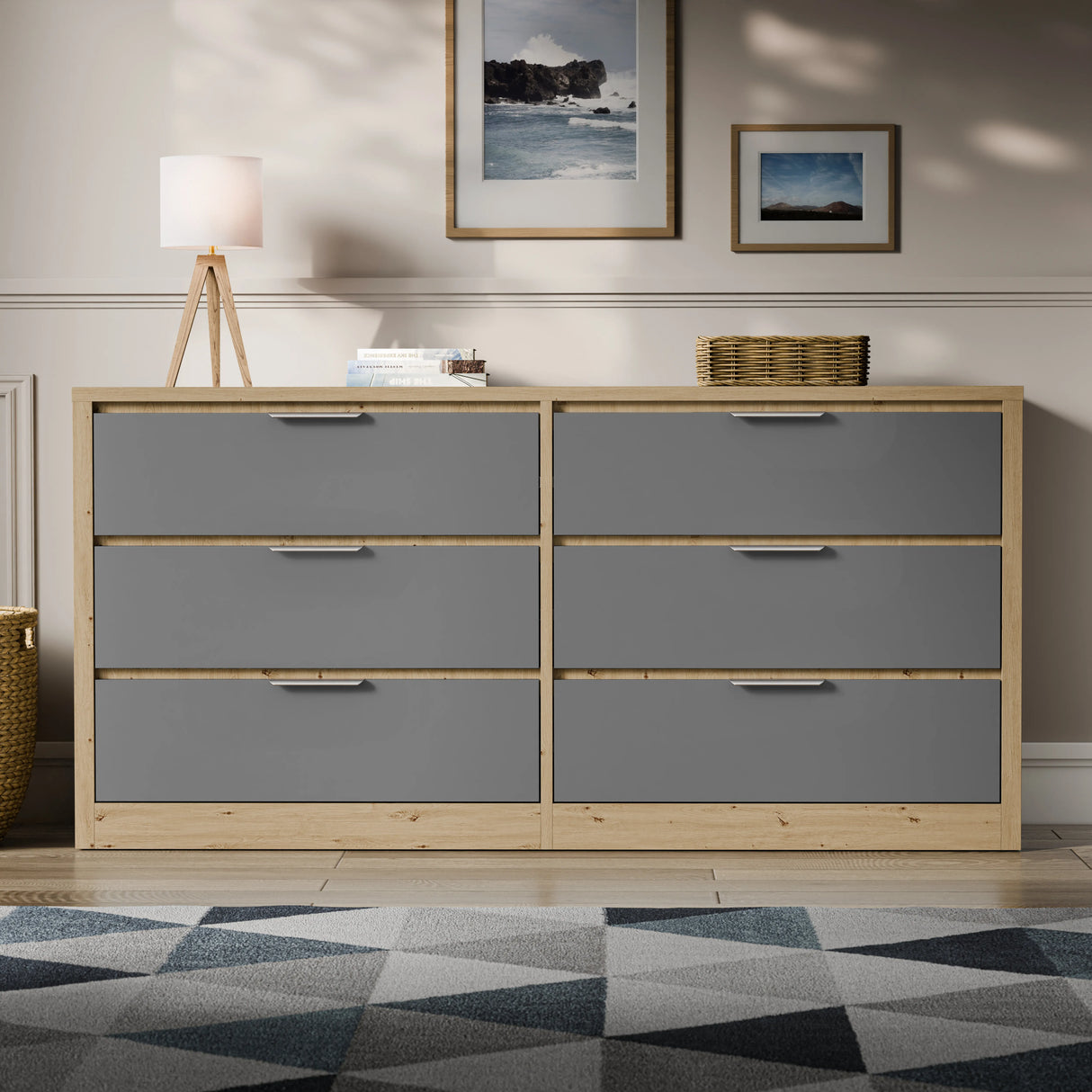 Two-tone finish wide chest of drawers placed in a bright room with a patterned rug and lamp