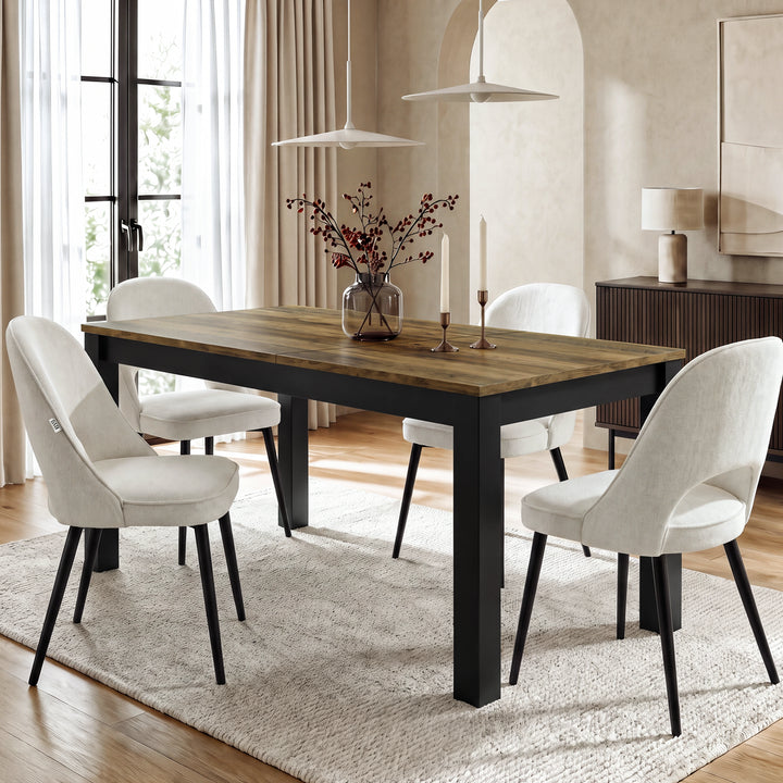[160cm | Oak] Closed table in bright dining room with four cream chairs, vase, candles, rug, and window light
