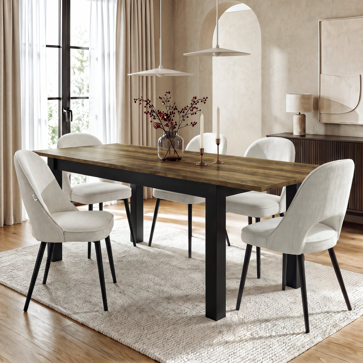 [140cm | Oak] Extended table in bright dining room with six cream chairs, vase, candles, rug, and pendant lights