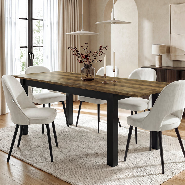 [160cm | Oak] Extended table in bright dining room with six cream chairs, vase, candles, rug, and pendant lights