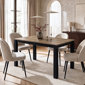 [140cm | Oak] Closed 140cm extendable table with four brown chairs, light oak top, vase, wooden tray and cream-white frame.