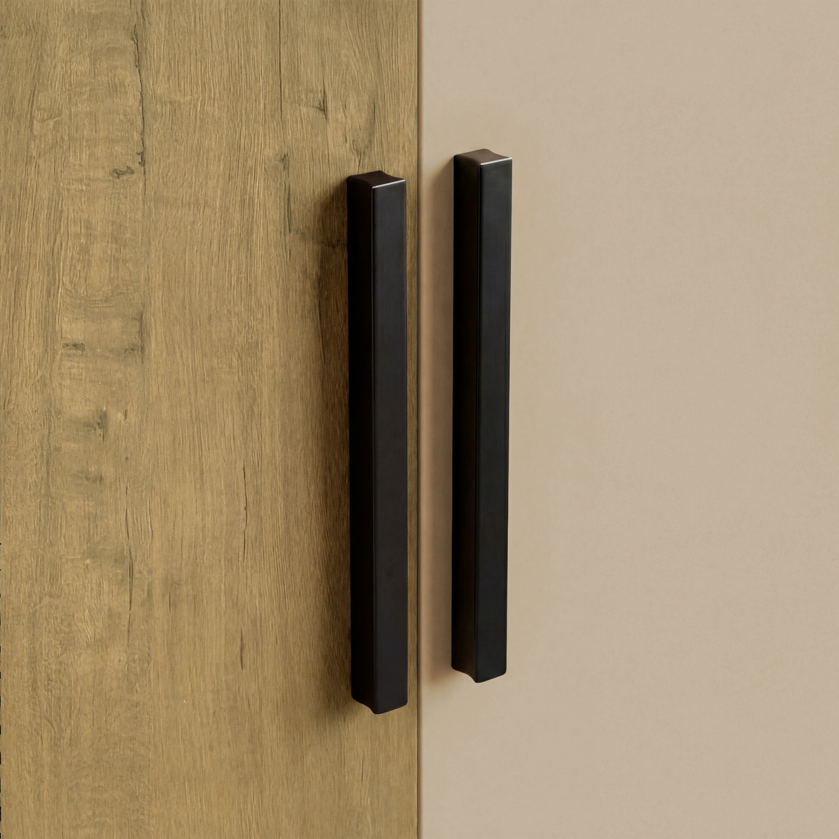 [Oak+Cashmere] Close view of black vertical wooden handles mounted on oak and kashmira three door plain wardrobe