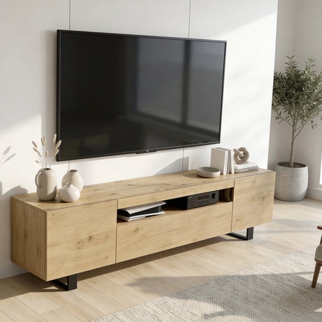 [Oak] Kystra TV stand in a sunlit Scandi living room viewed from a slight angle, showing closed oak cabinets, open centre shelf with AV unit, and white ceramic vases on top