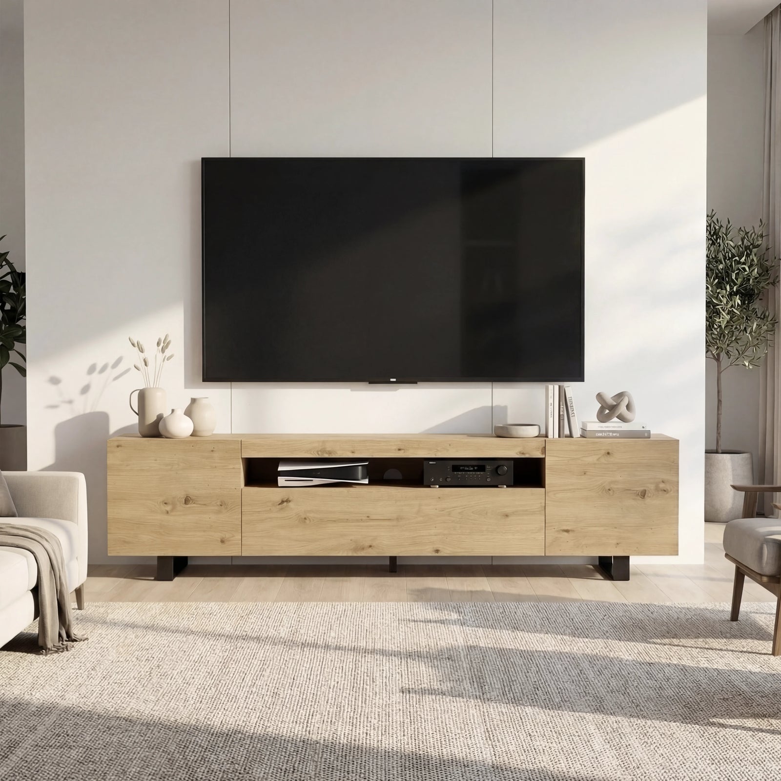 [Oak] Oak Kystra TV stand straight on, cream armchairs each side, AV gear in centre shelf, black iron legs on a rug