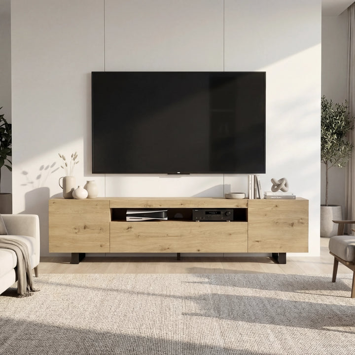 [Oak] Oak Kystra TV stand straight on, cream armchairs each side, AV gear in centre shelf, black iron legs on a rug