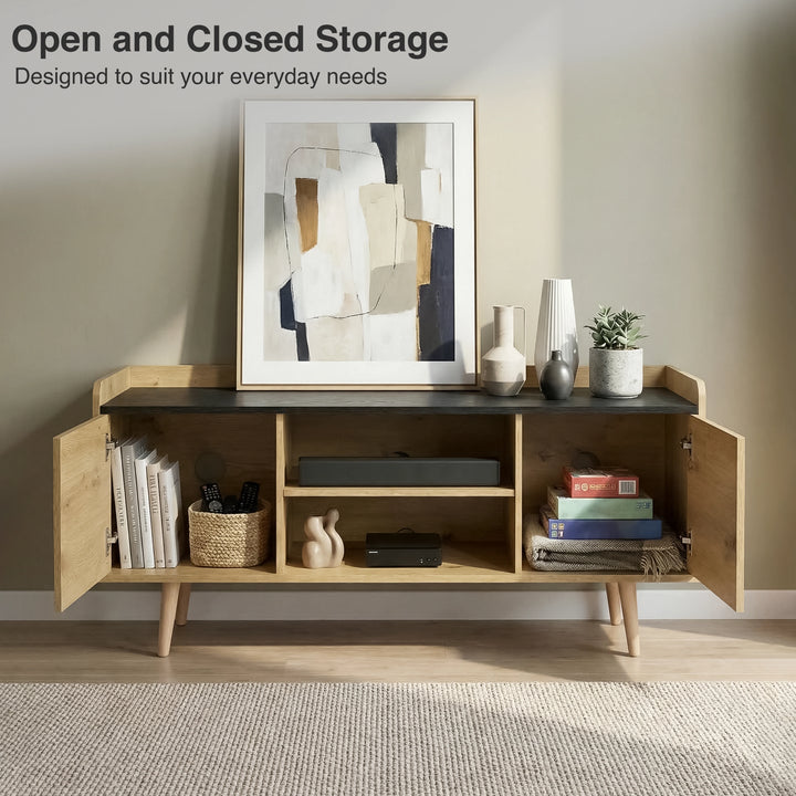 [Oak] Larvik front view with both doors open revealing books, woven basket, soundbar, board games, and cable hole on sage-toned wall