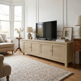 [Oak] Oskara TV unit 180cm in elegant neutral room with large TV, lamp and vase, lifestyle setting