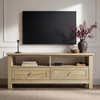 [Oak] Oskara TV unit front view in living room below wall-mounted TV styled with black candlestick, red berry vase, wooden bowl, and media player